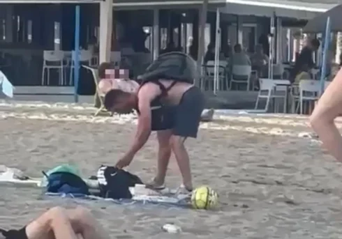 WATCH: Brazen thieves rummage through belongings on a Malaga beach - before being caught moments later